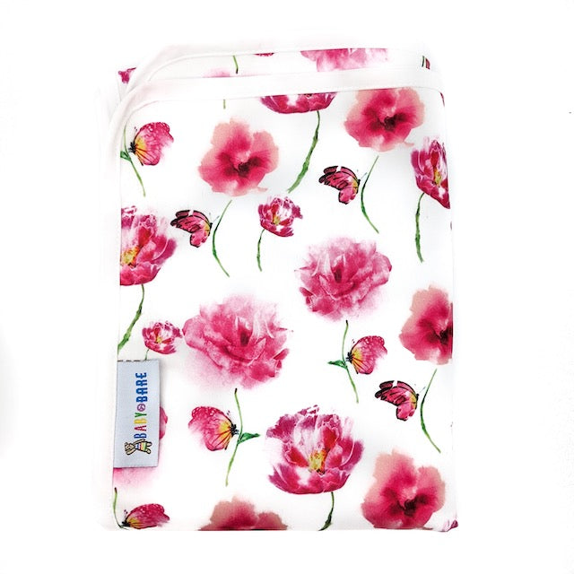 A Change Mat featuring pink flowers and butterflies