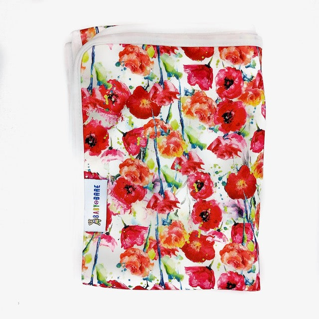 A Change Mat featuring a poppy print