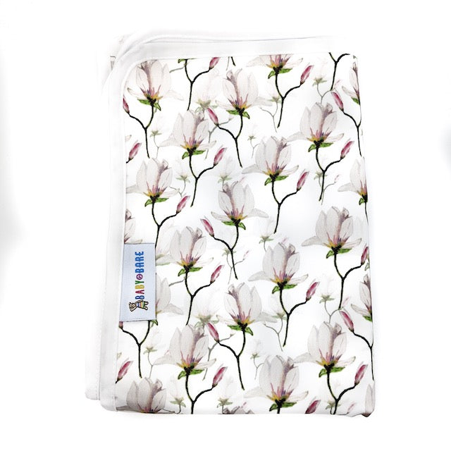 A Change Mat featuring a magnolia floral print