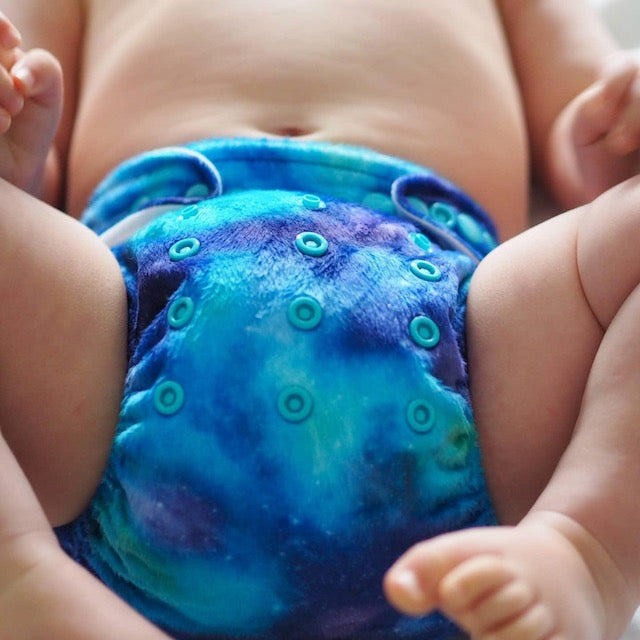 Baby wearing a soft blue minky cloth nappy