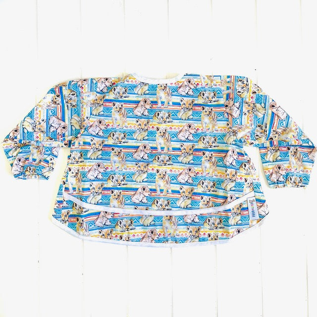 Baby Smock featuring a lion cub print