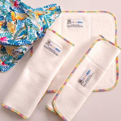 Baby Bare Tri-Fold nappy boosters and a colourful nappy with kingfisher print