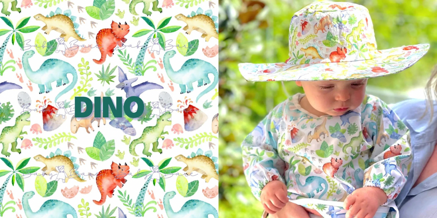 Baby feeding smock and sunhat in a dinosaur print