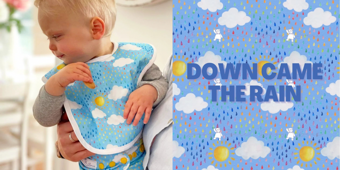 Colourful baby bib featuring raindrops and suns