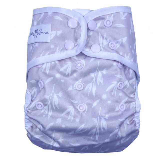 A pink reusable nappy cover featuring a simple blossom pattern