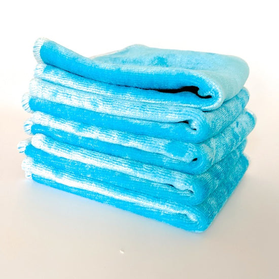 A stack of bright blue cloth baby wipes