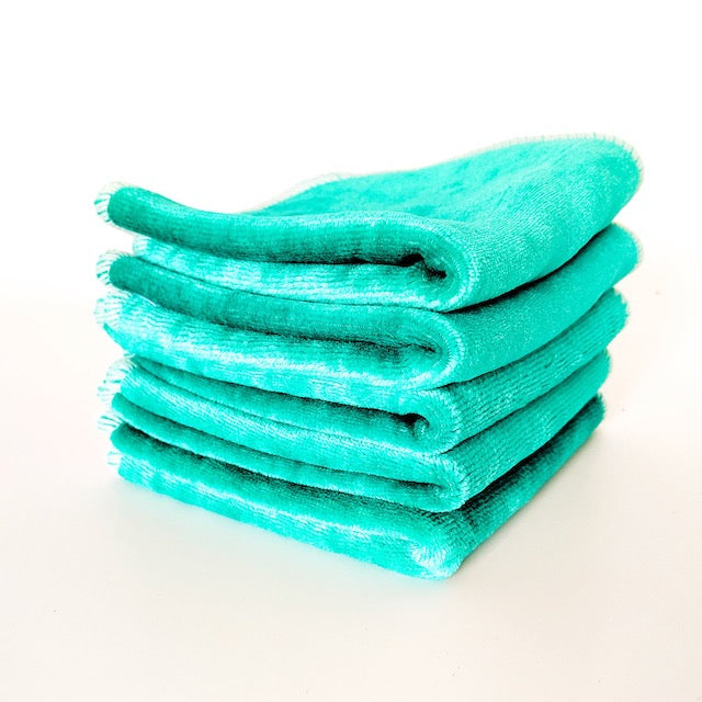 A stack of jade green cloth baby wipes