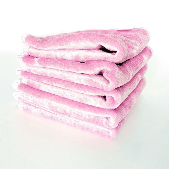 A stack of shell pink cloth baby wipes