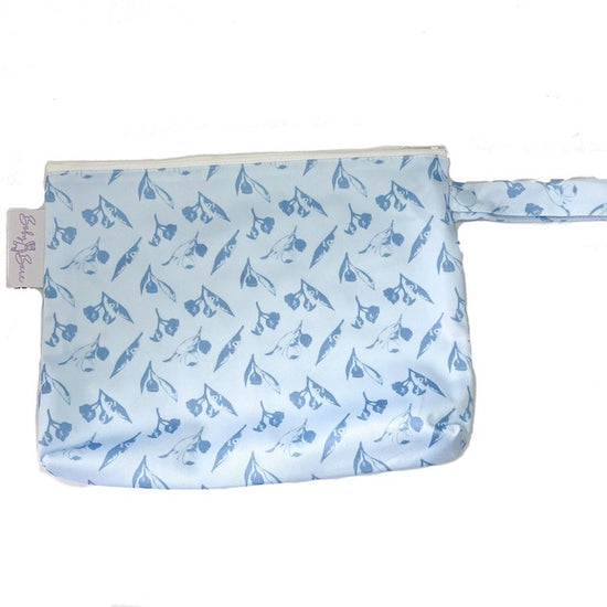 A small blue wet bag featuring a simple gumnut print