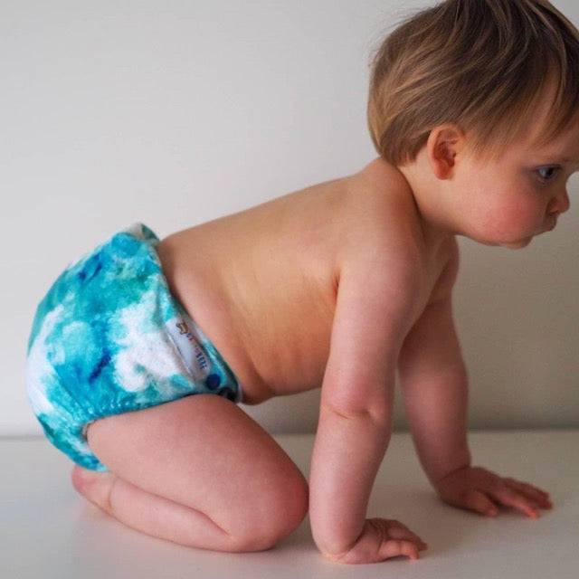 Baby wearing a soft blue minky cloth nappy