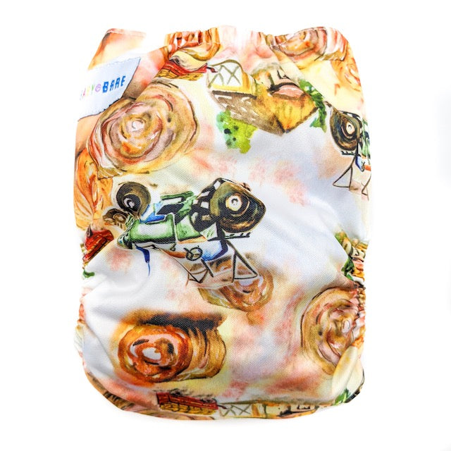 Side snapping cloth nappy featuring a tractor print