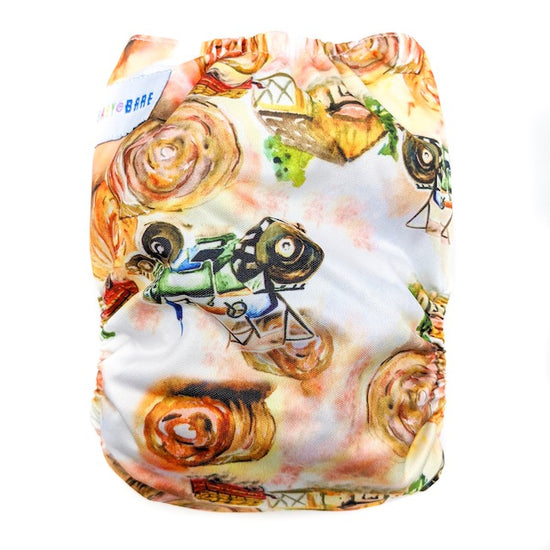 Side snapping cloth nappy featuring a tractor print