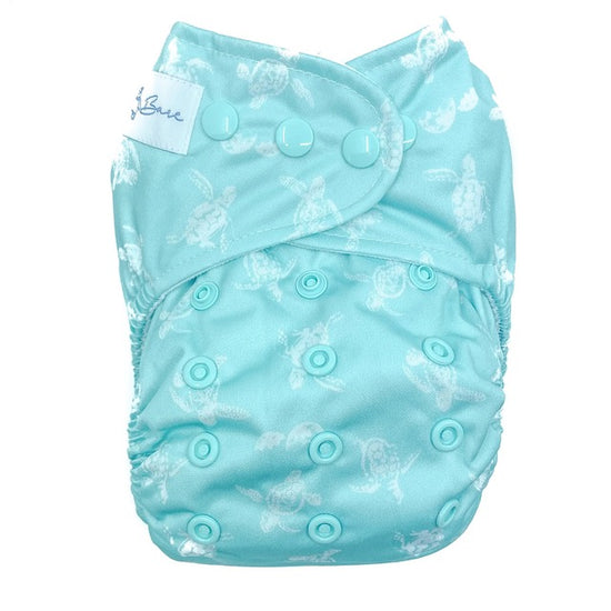 A reusable cloth nappy with a turtle print on a blue base